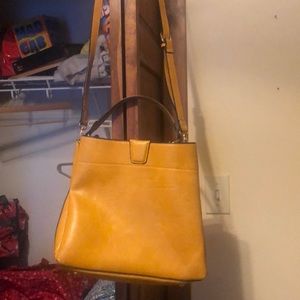 Purse. Deep yellow. Shoulder strap and small strap.